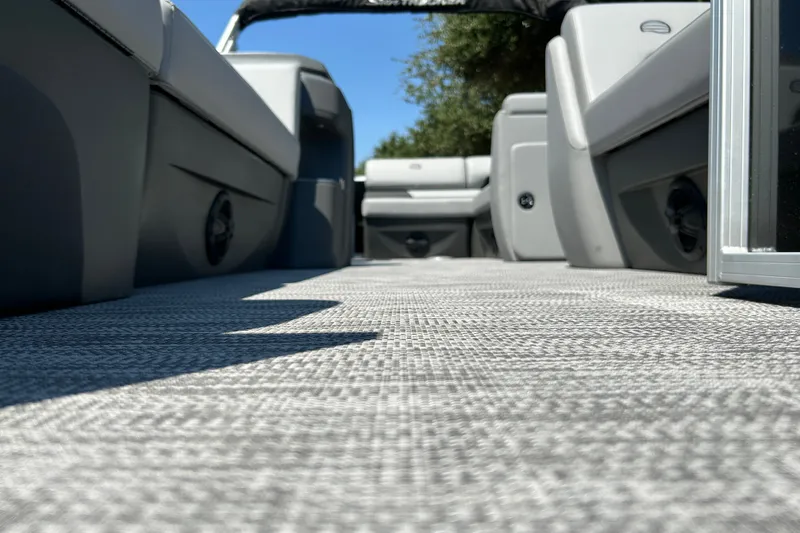 Slide: The Image of Interior view of 2026 Sun Tracker Party Barge 20 DLX pontoon boat with gray seating. - 21