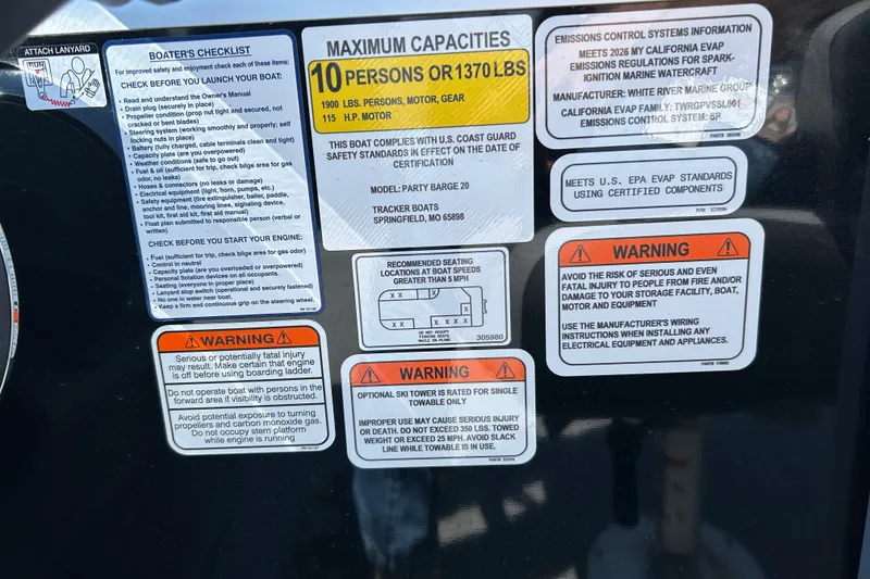 Slide: The Image of 2026 Sun Tracker Party Barge 20 DLX safety and capacity labels with warnings and instructions. - 97