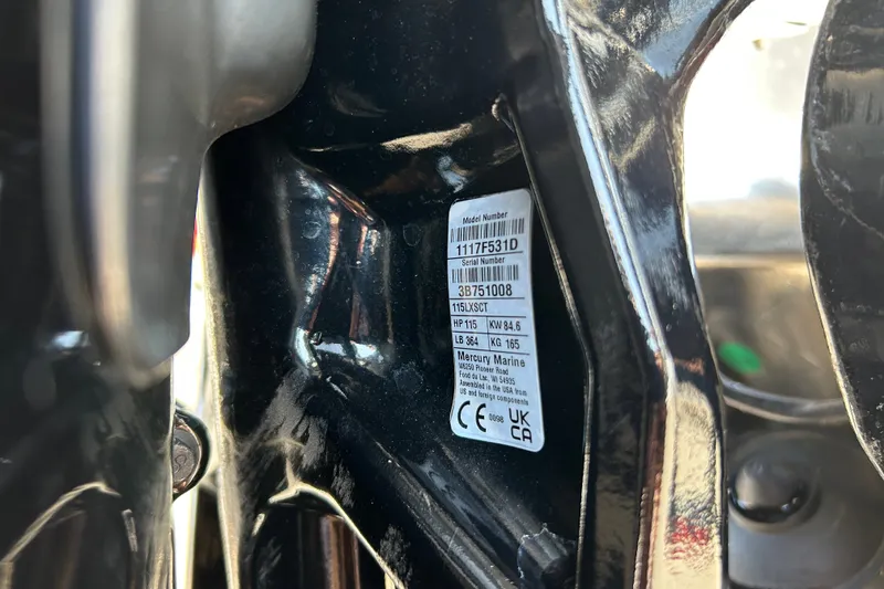 Slide: The Image of Close-up of a Mercury Marine engine label on a 2026 Sun Tracker Party Barge 20 DLX. - 99