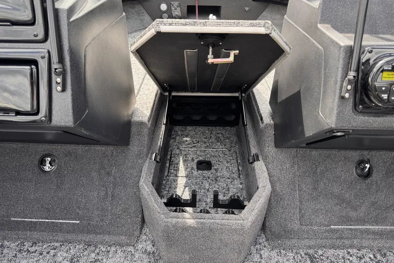 Slide: The Image of 2026 Tracker Targa V-19 WT boat interior storage compartment, open and empty. - 10