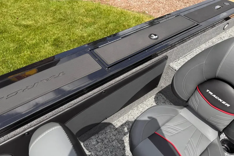 Slide: The Image of 2026 Tracker Targa V-19 WT boat interior with sleek seating and storage compartments. - 13