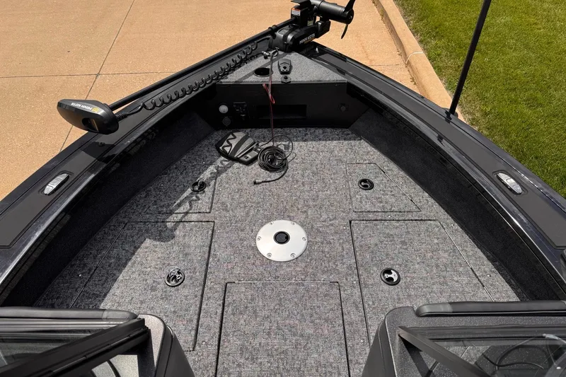 Slide: The Image of 2026 Tracker Targa V-19 WT boat deck with trolling motor and storage compartments. - 15