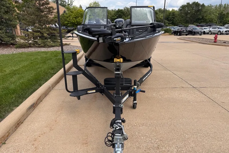 Slide: The Image of 2026 Tracker Targa V-19 WT boat on trailer, parked on concrete driveway. - 3