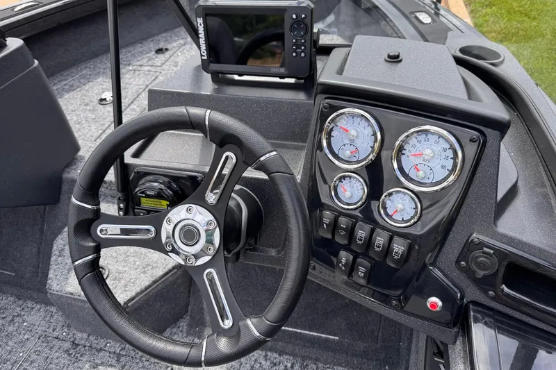 Slide: The Image of Steering console of 2026 Tracker Targa V-19 WT boat with gauges and navigation system. - 7