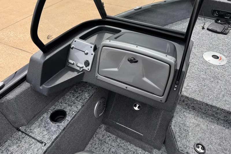 Slide: The Image of 2026 Tracker Pro Guide V-175 WT boat interior with storage compartment and carpeted flooring. - 12