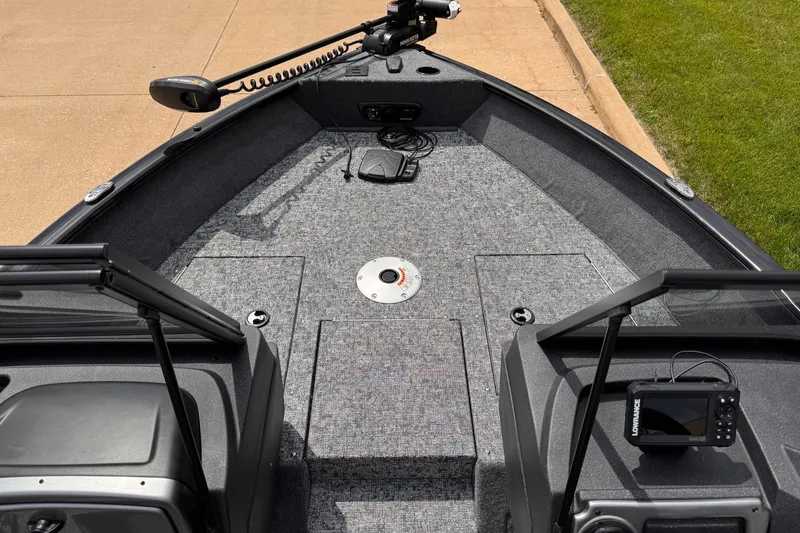 Slide: The Image of 2026 Tracker Pro Guide V-175 WT boat interior with fishing equipment and navigation system. - 6