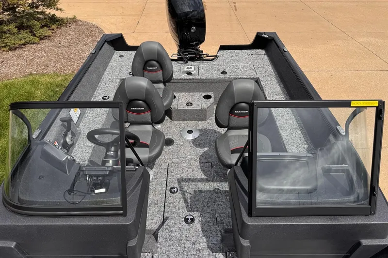 Slide: The Image of 2026 Tracker Pro Guide V-175 WT boat interior with seating and steering console. - 7