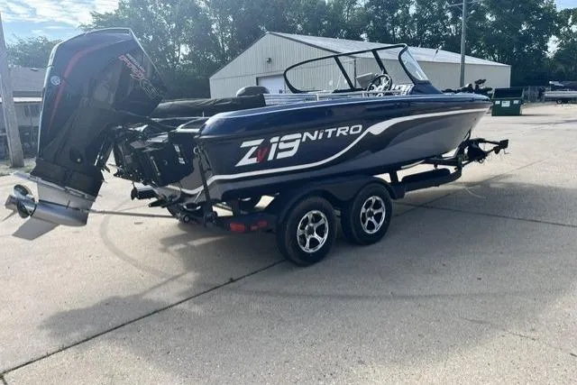 The Image of 2026 Nitro ZV19 Sport Pro boat on trailer, parked outdoors. - 0