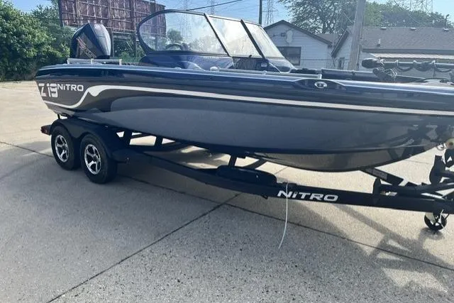 Slide: The Image of 2026 Nitro ZV19 Sport Pro boat on trailer, parked outdoors. - 2