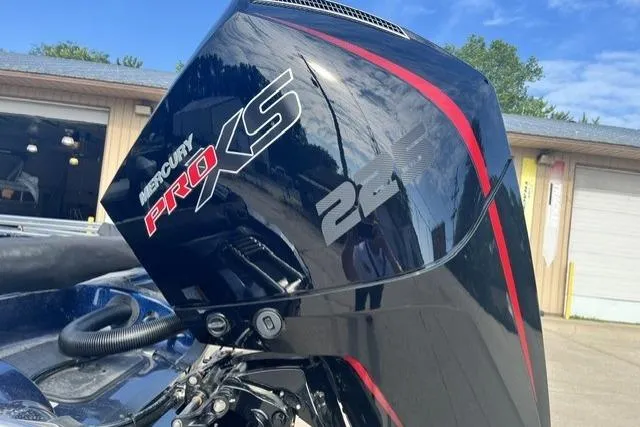Slide: The Image of 2026 Nitro ZV19 Sport Pro with Mercury Pro XS 225 engine, parked outdoors. - 8