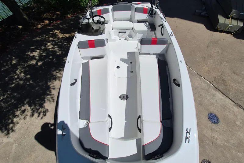 Slide: The Image of 2026 Tahoe T18 boat interior with white and red seating, spacious layout, and modern design. - 10