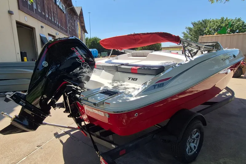 Slide: The Image of 2026 Tahoe T18 boat with Mercury Pro XS engine, parked on a trailer. - 5
