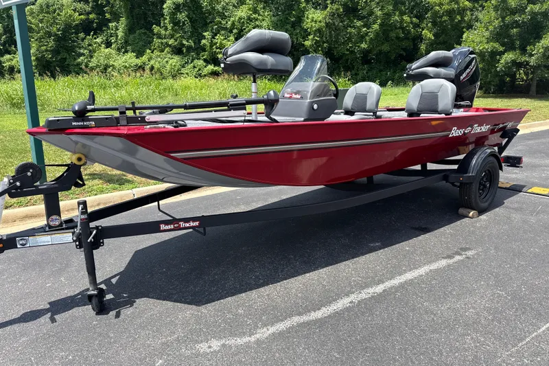 The Image of 2026 Tracker Bass Tracker Classic XL boat on trailer, red exterior, parked outdoors. - 0