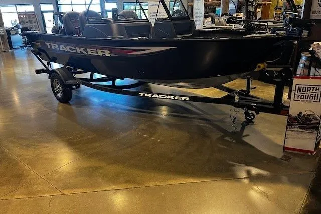 The Image of 2026 Tracker Pro Guide V-16 WT boat displayed indoors on a trailer. - 0