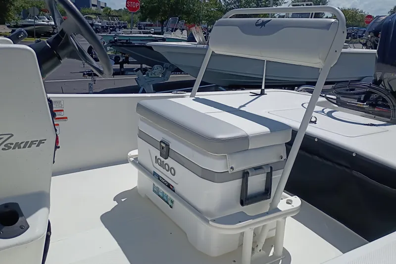 Slide: The Image of 2026 Mako Pro Skiff 17 CC boat interior with Igloo cooler seat. - 1