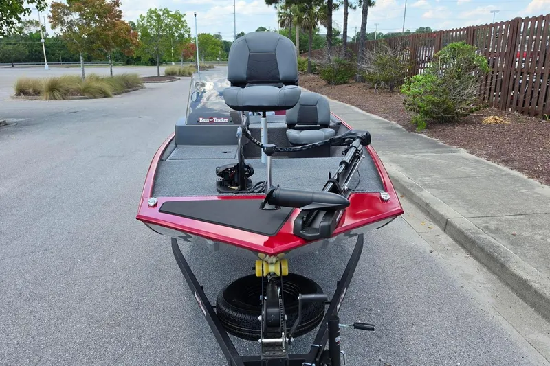 Slide: The Image of 2026 Tracker Bass Tracker Classic XL boat, red exterior, parked on a street. - 5