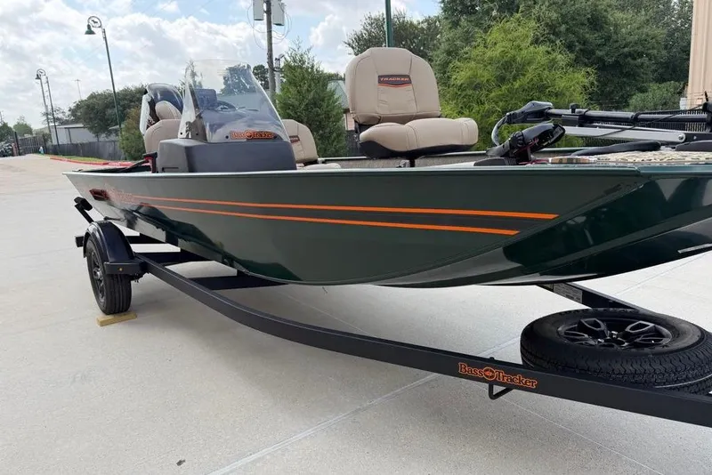 Slide: The Image of 2026 Tracker Bass Tracker Classic Limited boat on trailer, parked outdoors. - 13