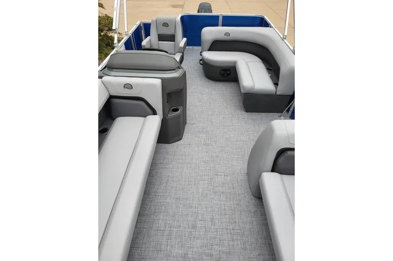 Slide: The Image of 2026 Sun Tracker Party Barge 18 DLX interior with gray seating and spacious layout. - 3