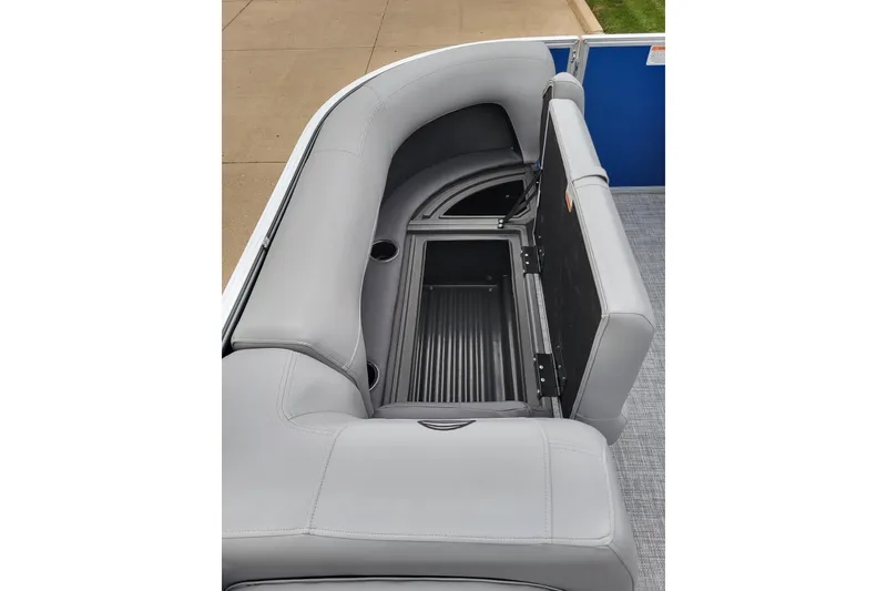 Slide: The Image of 2026 Sun Tracker Party Barge 18 DLX pontoon boat with open storage compartment and gray seating. - 7