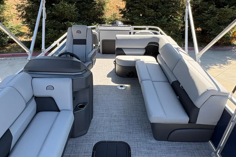 Slide: The Image of 2026 Sun Tracker Sportfish 24 XP3 pontoon boat interior with spacious seating and modern design. - 10