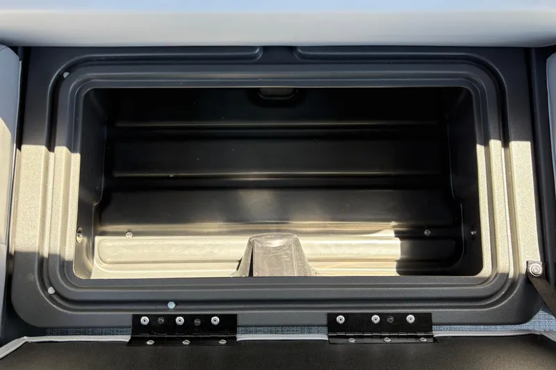 Slide: The Image of Storage compartment of 2026 Sun Tracker Sportfish 24 XP3 boat, open and empty. - 36