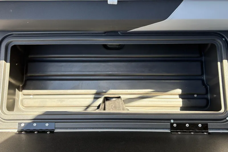 Slide: The Image of Open storage compartment in 2026 Sun Tracker Sportfish 24 XP3 boat. - 28