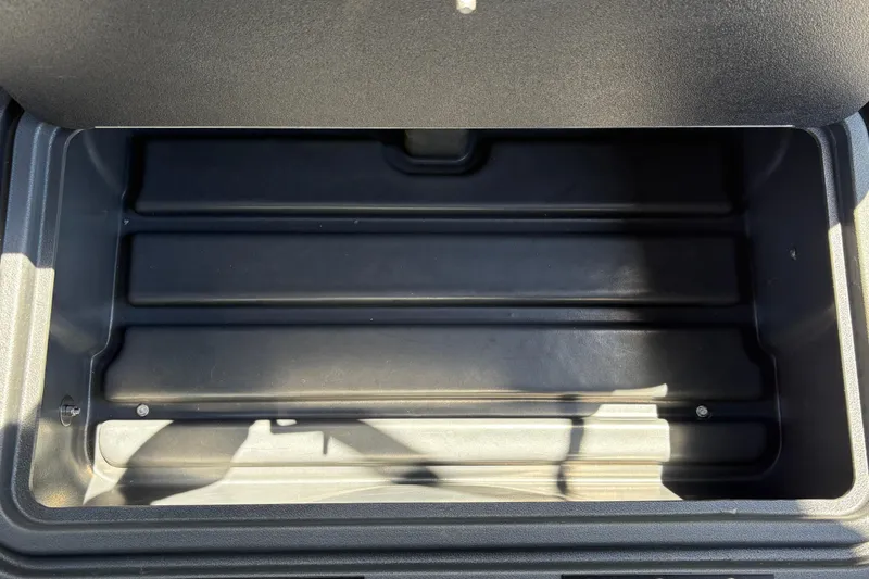 Slide: The Image of Empty storage compartment in 2026 Sun Tracker Sportfish 24 XP3 boat. - 30