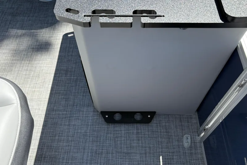 Slide: The Image of Interior view of 2026 Sun Tracker Sportfish 24 XP3 boat, featuring seating and flooring. - 19