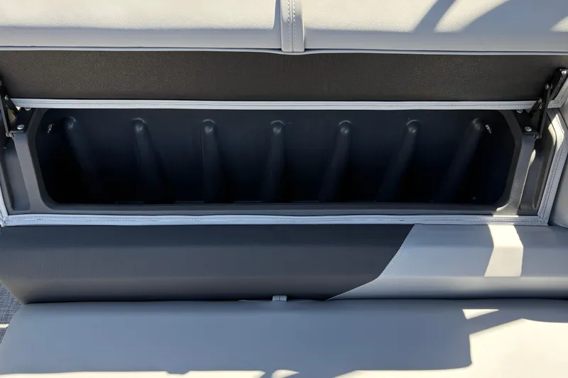 Slide: The Image of Open storage compartment in 2026 Sun Tracker Sportfish 24 XP3 boat seat. - 38
