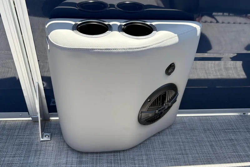 Slide: The Image of Cup holder and speaker on 2026 Sun Tracker Sportfish 24 XP3 boat interior. - 33