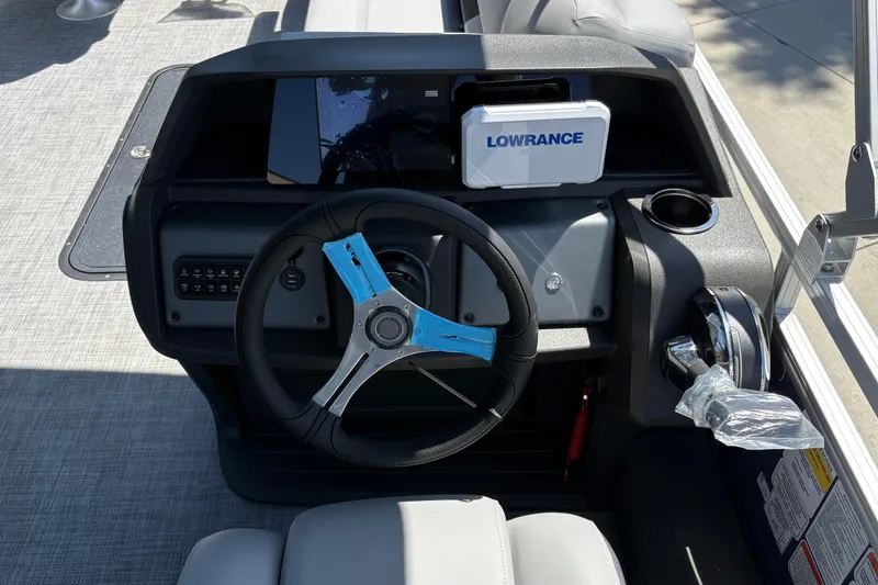 Slide: The Image of Steering console of 2026 Sun Tracker Sportfish 24 XP3 with Lowrance navigation system. - 35