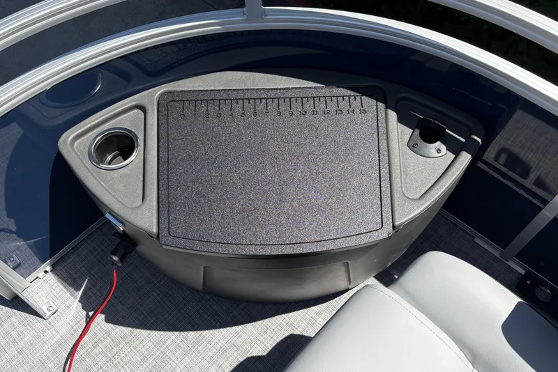 Slide: The Image of 2026 Sun Tracker Sportfish 24 XP3 boat deck with cup holders and measuring board. - 21