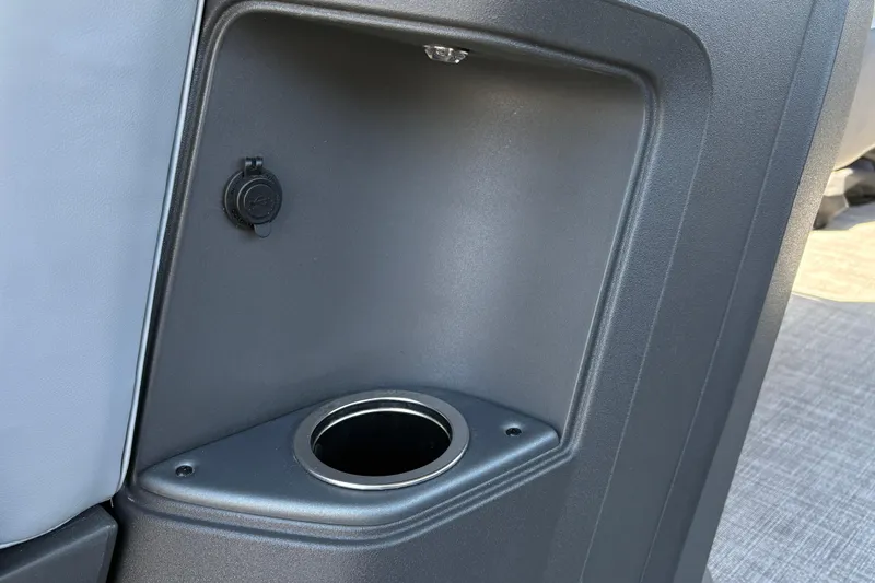 Slide: The Image of Cup holder and USB port on 2026 Sun Tracker Sportfish 24 XP3 boat interior. - 29