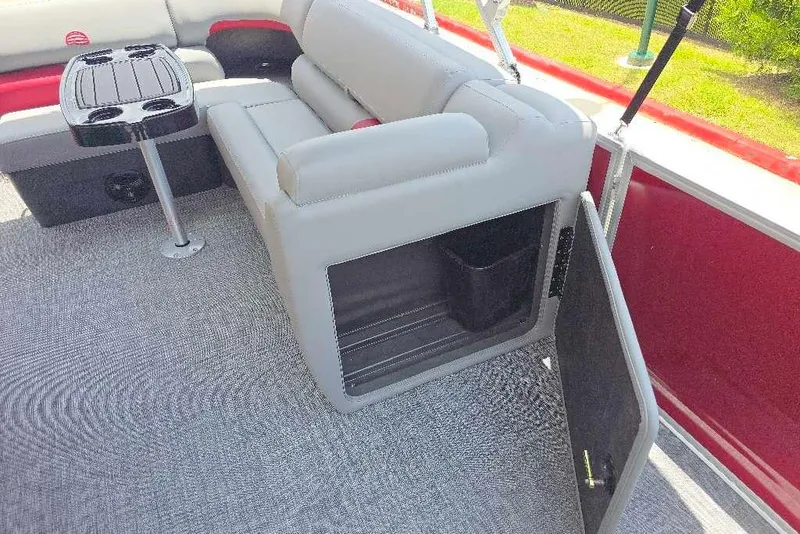 Slide: The Image of Interior of 2026 Sun Tracker Party Barge 20 DLX with seating and storage compartment. - 10