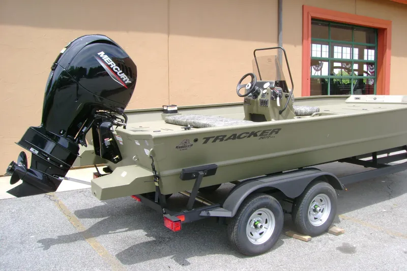 Slide: The Image of 2026 Tracker Grizzly 2072 CC boat on trailer with Mercury outboard motor. - 2
