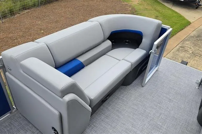 Slide: The Image of 2026 Sun Tracker Party Barge 20 DLX pontoon boat with gray and blue seating. - 8