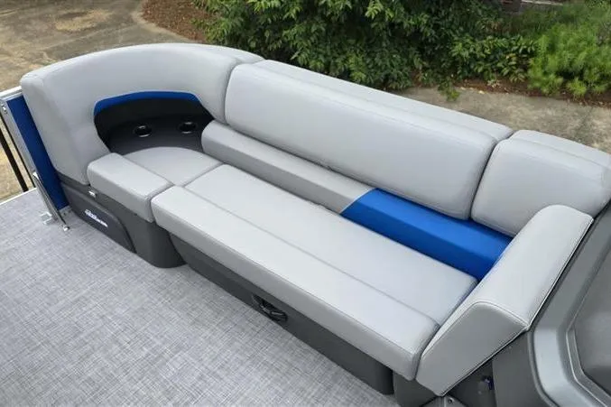 Slide: The Image of 2026 Sun Tracker Party Barge 20 DLX interior with gray and blue seating. - 12