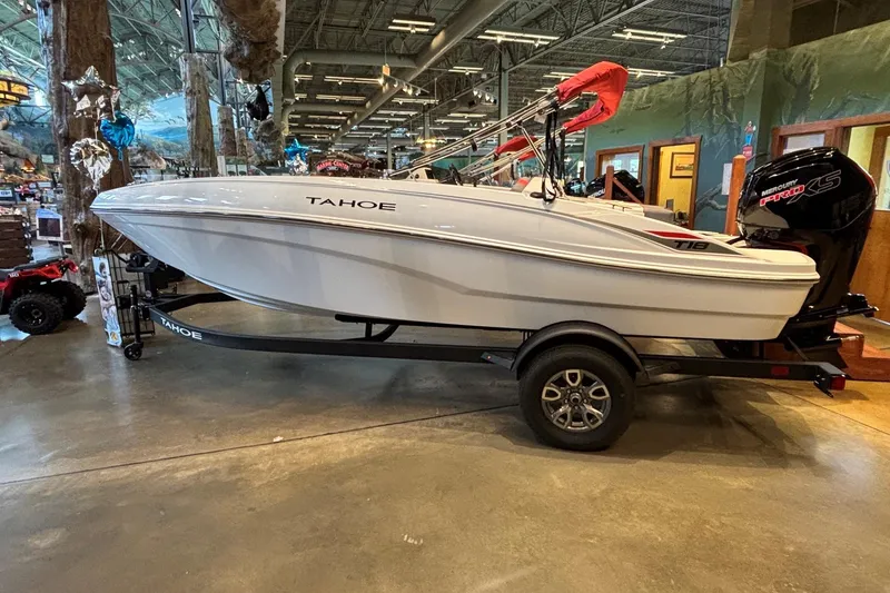 The Image of 2026 Tahoe T18 boat displayed indoors on a trailer. - 0