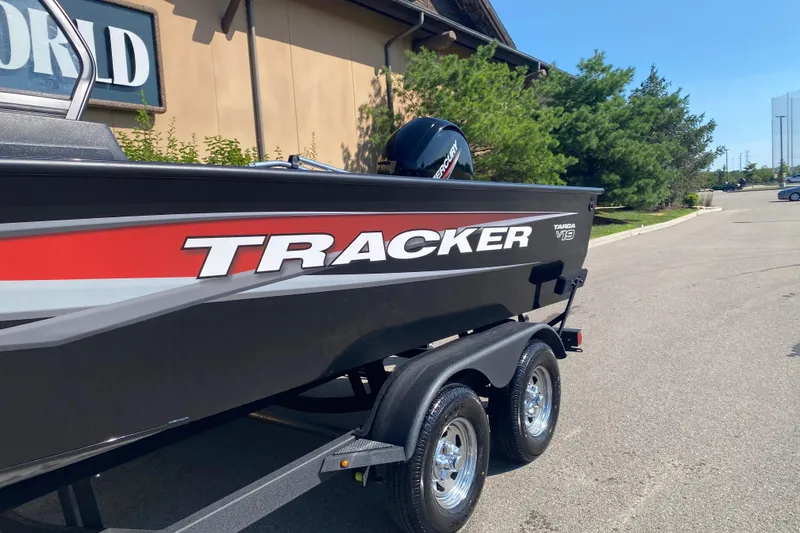 Slide: The Image of 2026 Tracker Targa V-19 Combo boat on trailer, parked outdoors. - 2