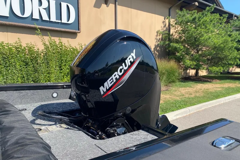 Slide: The Image of 2026 Tracker Targa V-19 Combo with Mercury outboard motor, parked outdoors. - 4