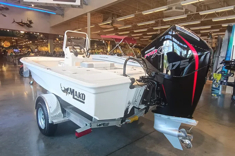 Slide: The Image of 2026 Mako 18 Pro Skiff boat with Mercury Pro XS 175 engine in showroom. - 3