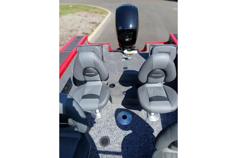 Slide: The Image of 2026 Tracker Targa V-18 WT boat interior with gray seating and red accents. - 3
