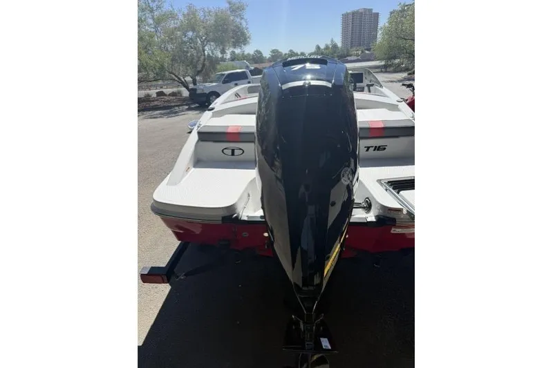 Slide: The Image of 2026 Tahoe T16 boat with powerful outboard motor, parked outdoors. - 5