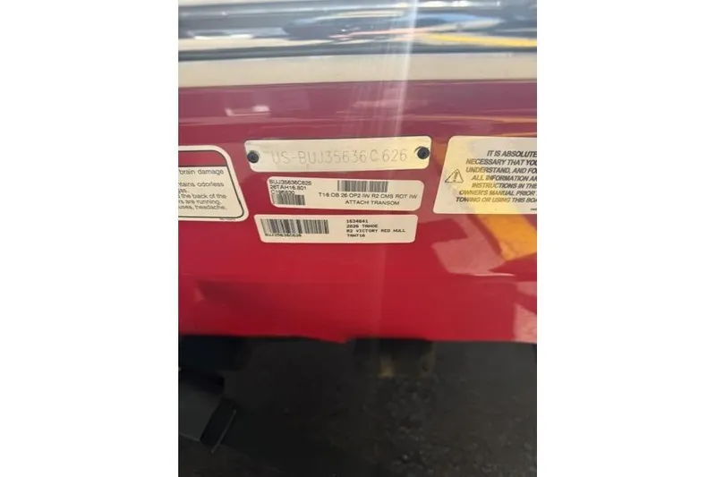 Slide: The Image of 2026 Tahoe T16 identification labels on a red surface. - 10