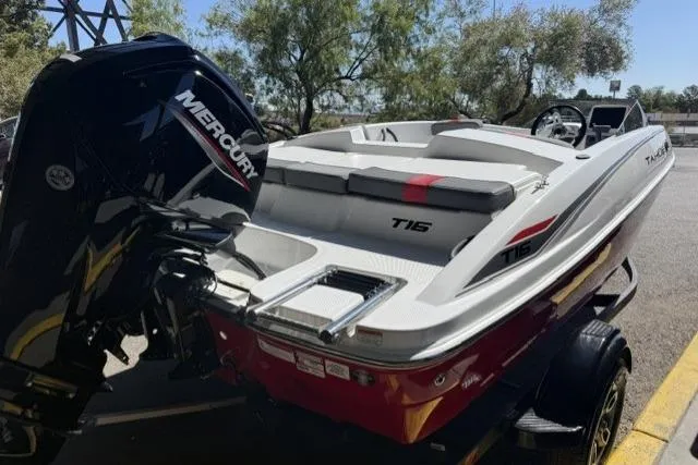 Slide: The Image of 2026 Tahoe T16 boat with Mercury engine, parked outdoors on a trailer. - 4