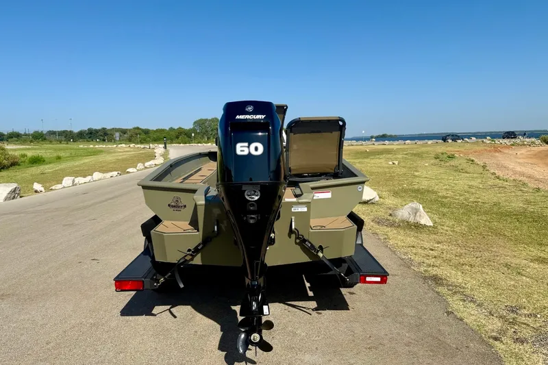 Slide: The Image of 2026 Tracker Grizzly 1756 T Marsh boat with Mercury 60 engine on a sunny day. - 22