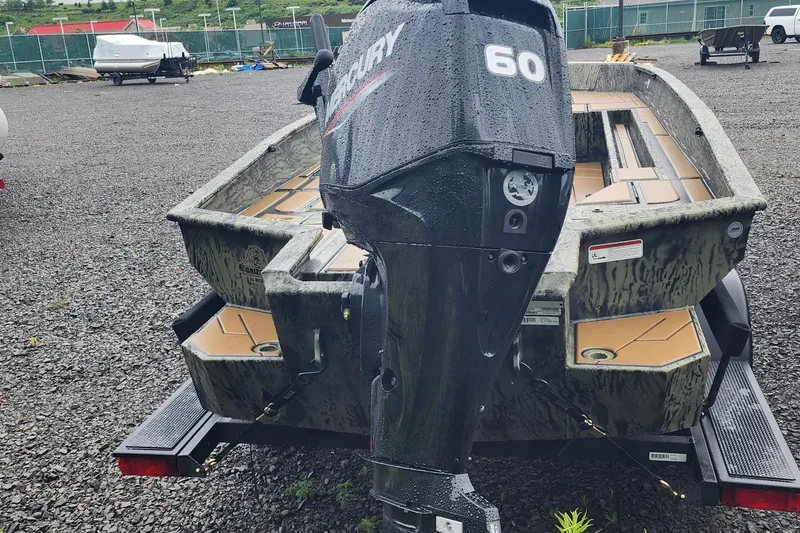 Slide: The Image of 2026 Tracker Grizzly 1756 T Marsh boat with Mercury 60 outboard motor on trailer. - 2
