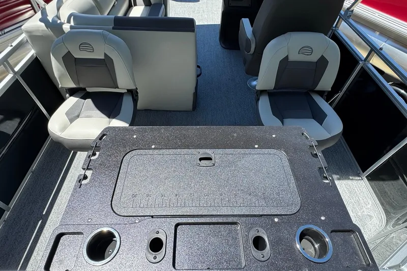 Slide: The Image of Interior of 2026 Sun Tracker Fishin' Barge 20 DLX with seating and fishing station. - 10