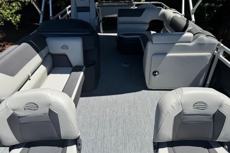 Slide: The Image of 2026 Sun Tracker Fishin' Barge 20 DLX interior with spacious seating and modern design. - 14