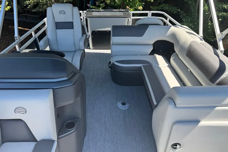 Slide: The Image of 2026 Sun Tracker Fishin' Barge 20 DLX interior with spacious seating and modern design. - 8